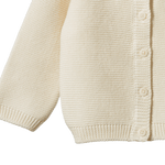 Cream organic cotton Pepi Cardigan with garter stitch knit and corozo nut buttons.