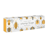 White matchbox-style box with yellow sides, featuring gray and yellow bug illustrations and "stamp bugs" text.